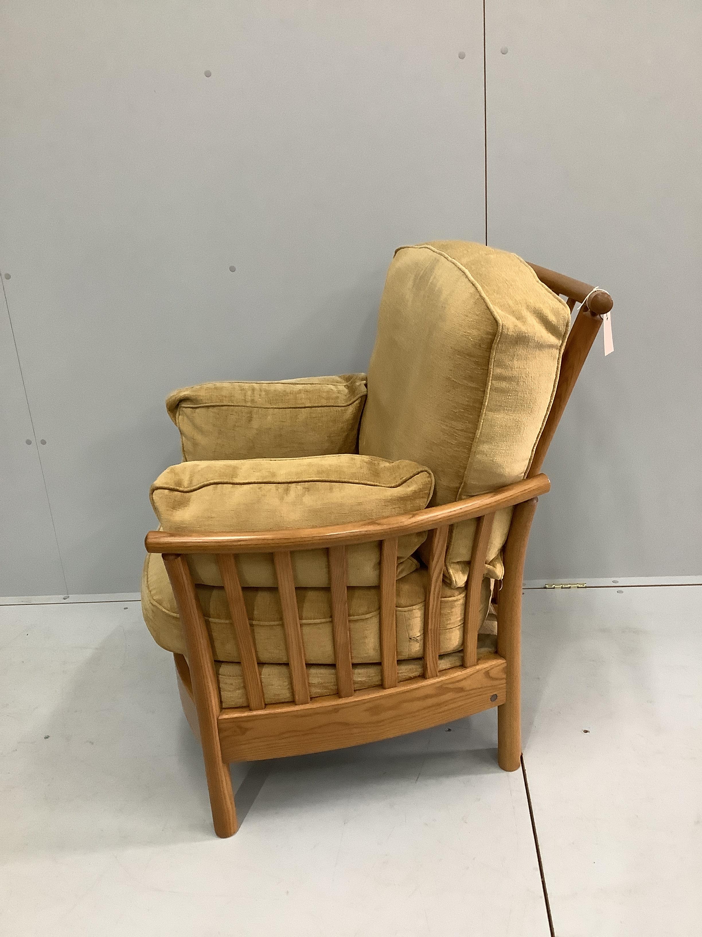 An Ercol oak armchair, width 82cm, depth 68cm, height 93cm